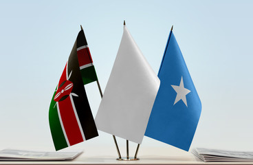 Flags of Kenya and Somalia with a white flag in the middle