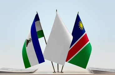 Flags of Lesotho and Namibia with a white flag in the middle