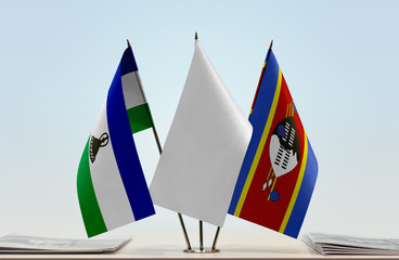 Flags of Lesotho and Swaziland with a white flag in the middle