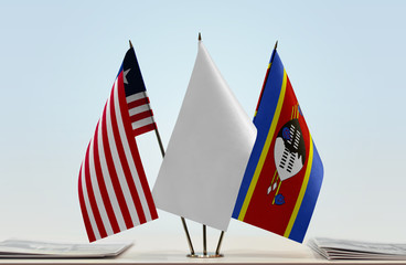 Flags of Liberia and Swaziland with a white flag in the middle