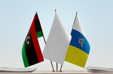 Flags of Libya and Canary Islands with a white flag in the middle