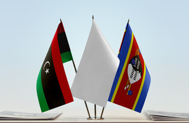 Flags of Libya and Swaziland with a white flag in the middle