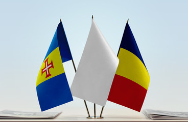 Flags of Madeira and Chad with a white flag in the middle