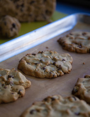 chocolate chip cookie on a baking sheet