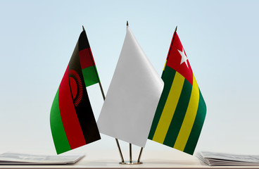 Flags of Malawi and Togo with a white flag in the middle