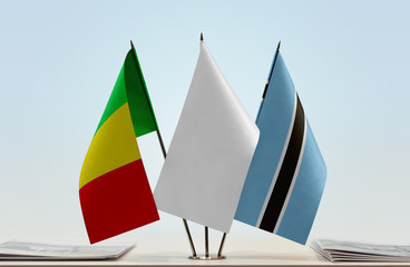 Flags of Mali and Botswana with a white flag in the middle