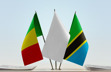 Flags of Mali and Tanzania with a white flag in the middle