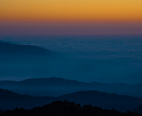 The sun rises on the top of the hill