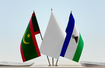 Flags of Mauritania and Lesotho with a white flag in the middle