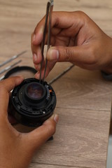 Fototapeta na wymiar repairing camera lens