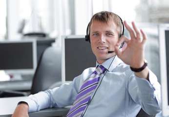 Young project manager participating in online meeting.