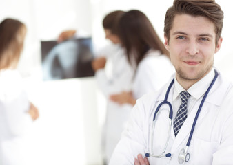 Fototapeta premium young doctor on the background of colleagues