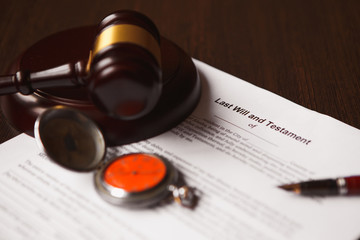 Notary's public pen and stamp on testament and last will.