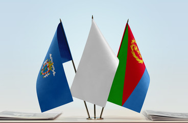 Flags of Melilla and Eritrea with a white flag in the middle