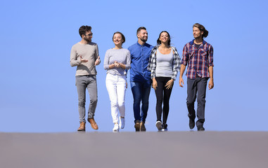 team of friends, walks on the road