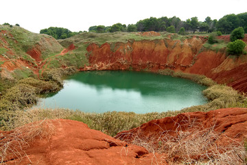 lake in ancient bauxite quarry in Otranto, Apulia, Italy