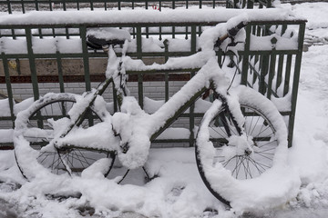 Snowfall snowstorm blizzard weather warning snow forecast snow in the city bicycle covered