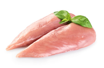 Raw chicken breast and basil isolated on white background.