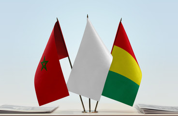 Flags of Morocco and Guinea with a white flag in the middle