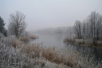 Naklejka na ściany i meble Winter on the frozen river