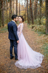 Beautiful girl and handsome guy in the Park in the fall.