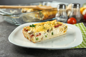 Plate with delicious casserole on table, closeup. Fresh from oven