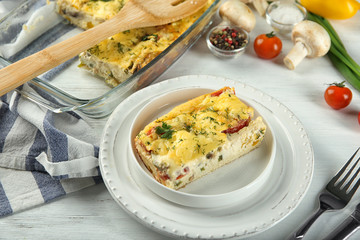 Plate with delicious casserole on table. Fresh from oven