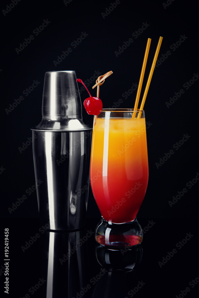 Canvas Prints glass of sex on the beach cocktail and shaker against black background