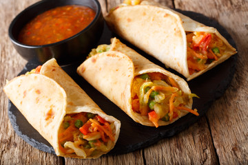 Indian veg spring roll stuffed with various vegetables close-up. Horizontal