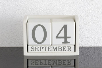 White block calendar present date 4 and month September