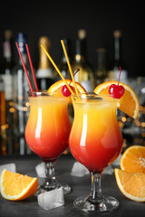 Bar counter with glasses of cocktail Sex on the Beach