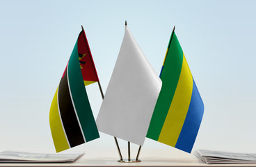 Flags of Mozambique and Gabon with a white flag in the middle