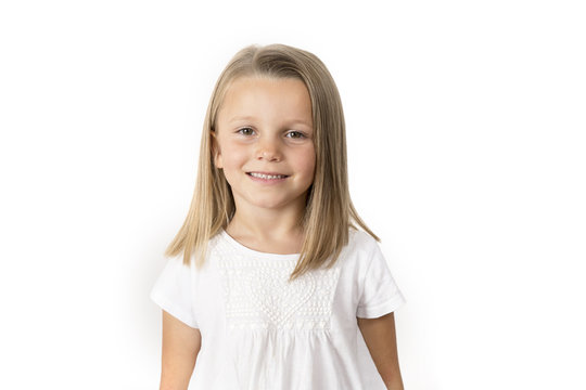 head shot portrait of sweet and beautiful 7 years old young girl with blond hair  smiling happy posing isolated on white background