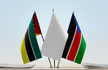 Flags of Mozambique and South Sudan with a white flag in the middle