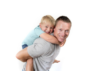 young attractive and athletic father carrying on his back young beautiful and blond son having fun together posing isolated on white background