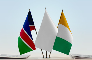 Flags of Namibia and Ivory Coast with a white flag in the middle