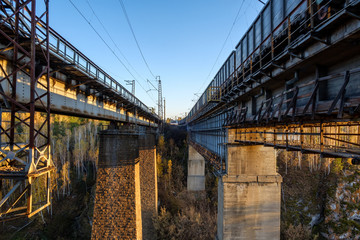 between the railway tracks of the bridge, outside the city outdoors, traveling to Russia