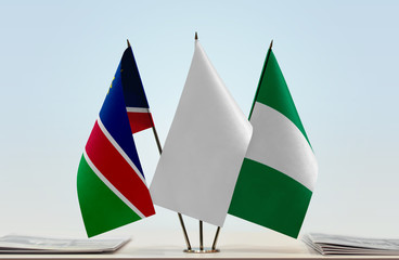 Flags of Namibia and Nigeria with a white flag in the middle