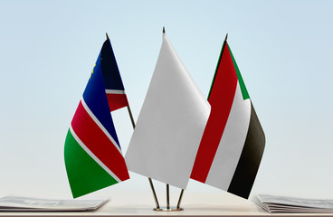Flags of Namibia and Sudan with a white flag in the middle