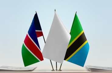 Flags of Namibia and Tanzania with a white flag in the middle