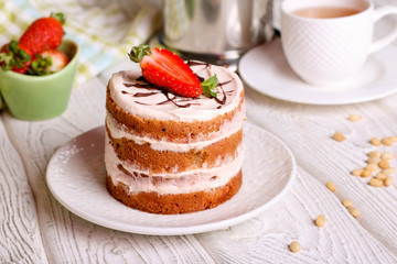 Strawberry Cake on a white plate. Homemade summer dessert