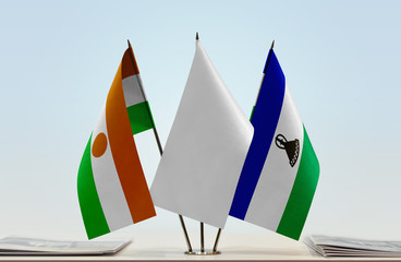 Flags of Niger and Lesotho with a white flag in the middle