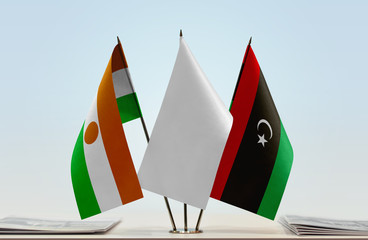 Flags of Niger and Libya with a white flag in the middle