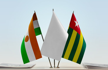 Flags of Niger and Togo with a white flag in the middle