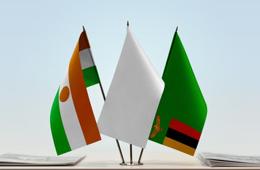Flags of Niger and Zambia with a white flag in the middle