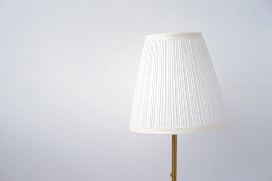 Bedside lamp in front of white background.