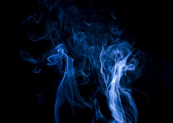 Fototapeta premium Blue smoke on black background