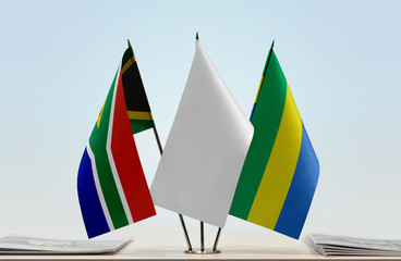 Flags of Republic of South Africa and Gabon with a white flag in the middle