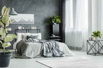 Bed with gray sheets