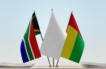 Flags of Republic of South Africa and Guinea-Bissau with a white flag in the middle